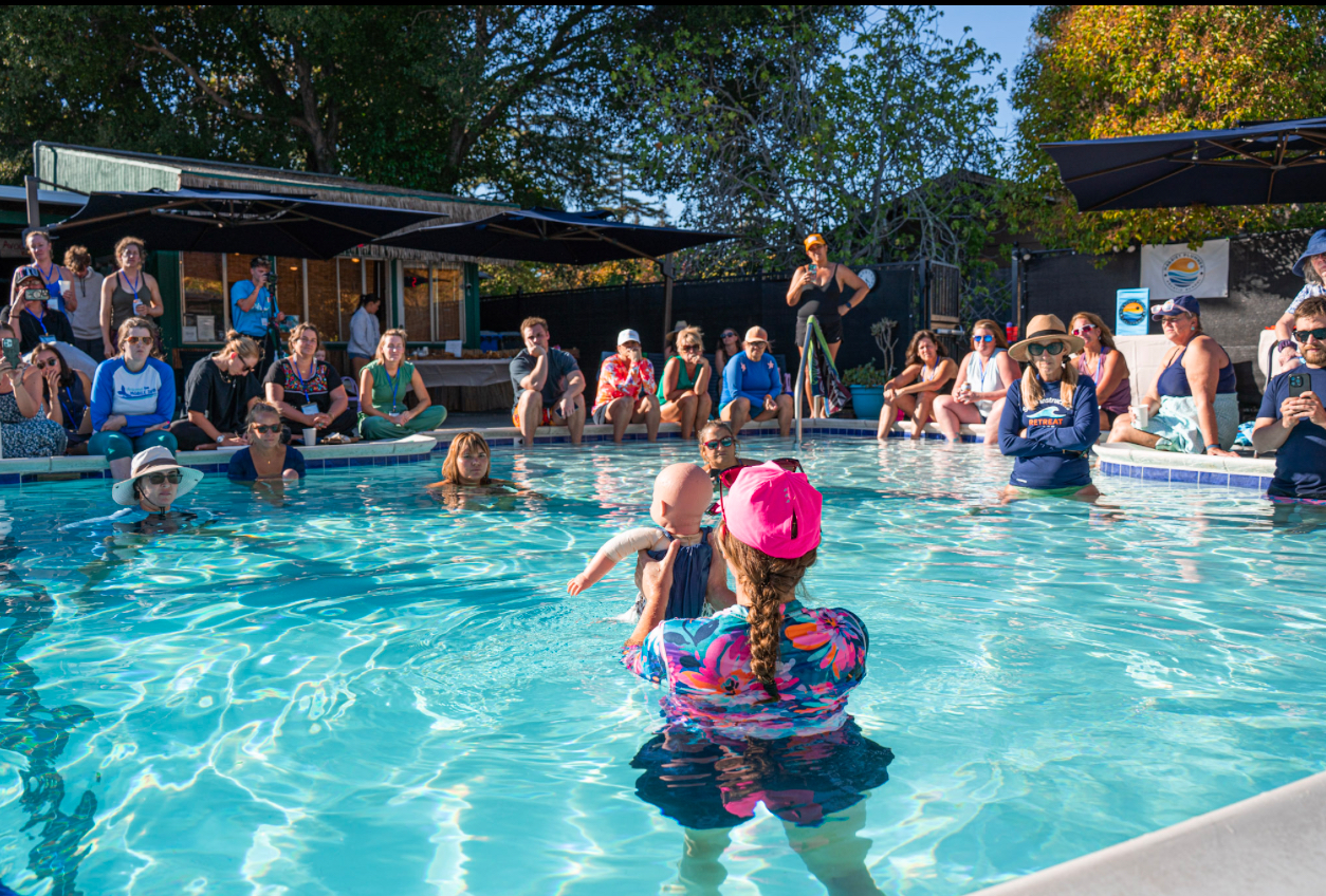 In-pool teaching demo with full audience watching